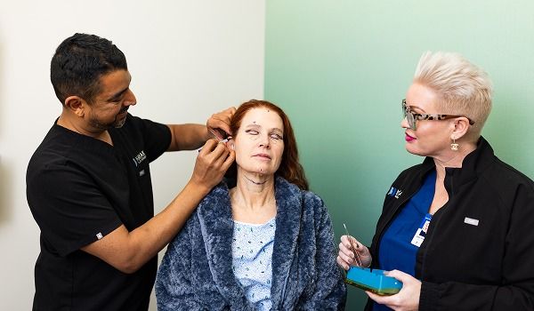 Dr. Kachare discussing treatment with patient.