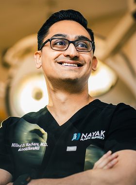 Dr. Kachare in surgical attire.