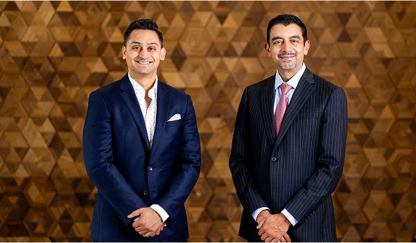 St. Louis facial plastic surgeon Dr. Nayak and  Dr. Kachare posing together.