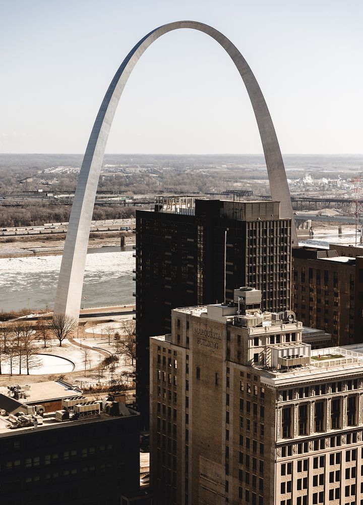St. Louis Arch with city skyline below.