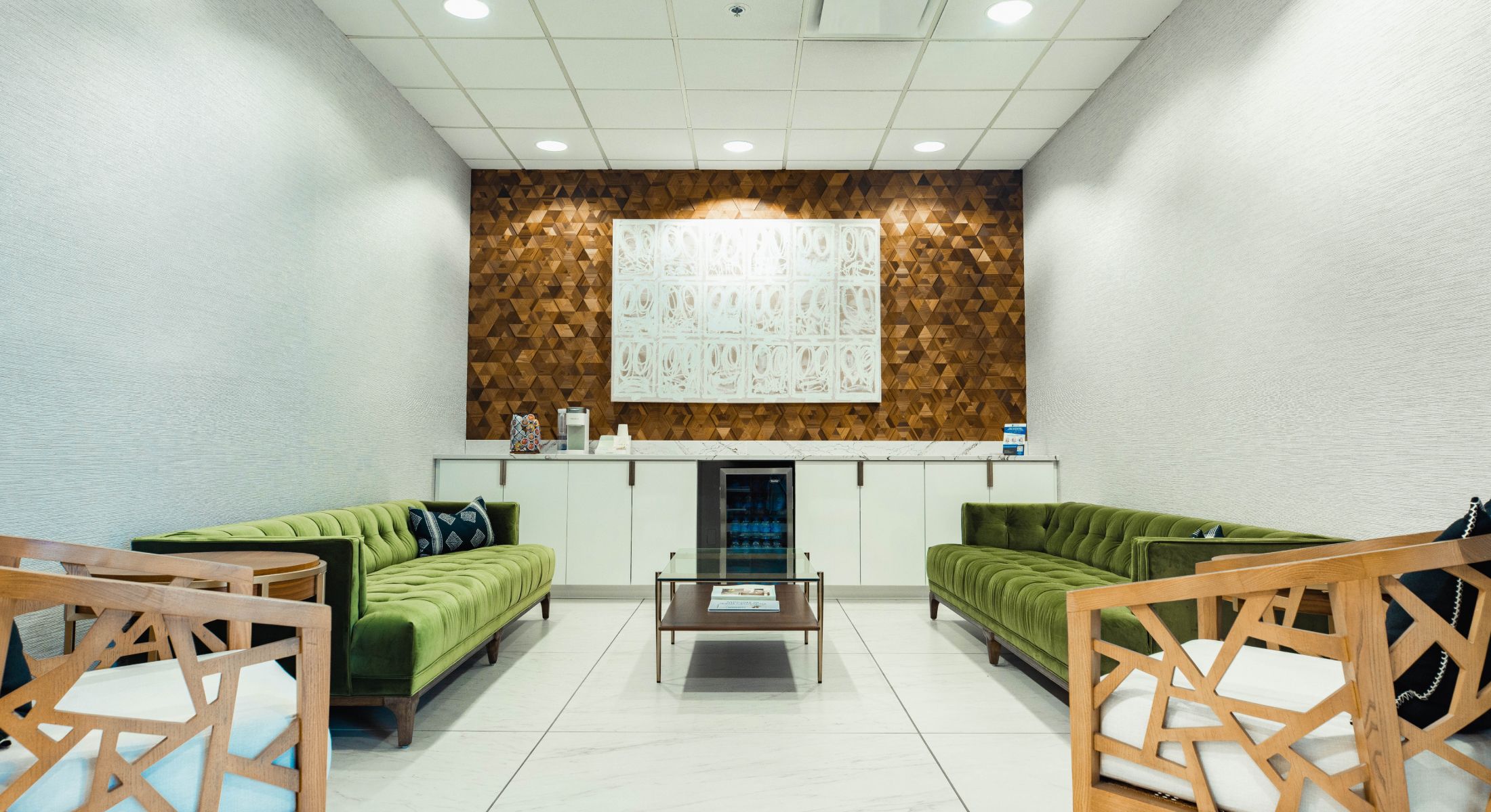 Nayak Plastic Surgery office interior with logo.
