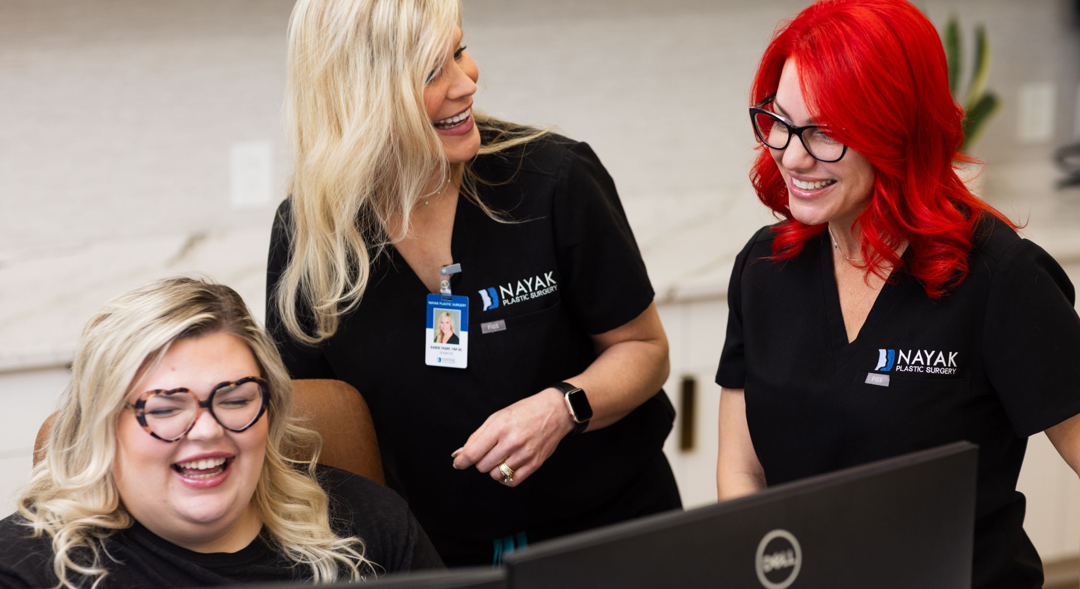 Medical staff engaging with a happy patient.