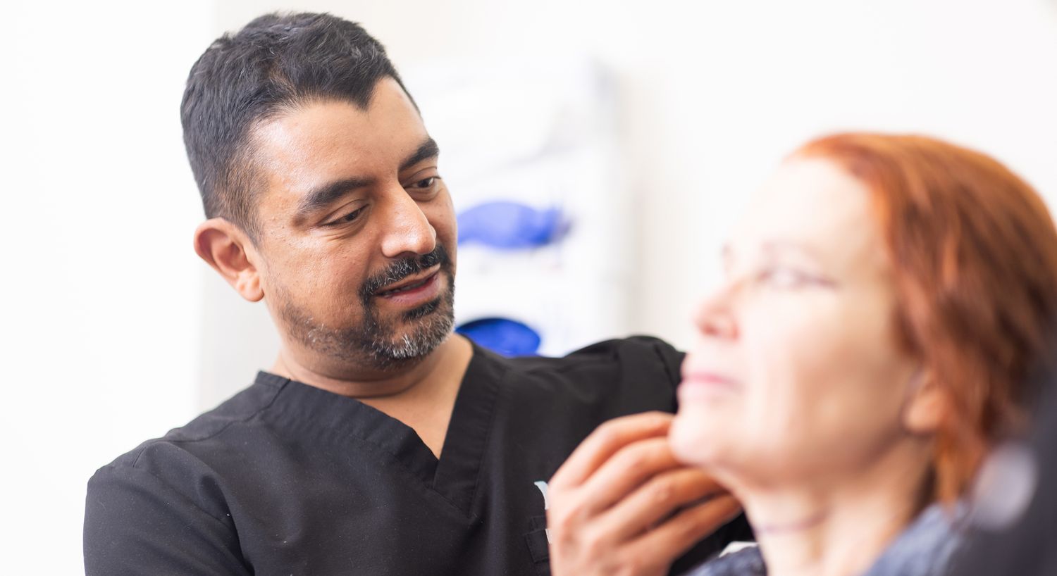 Medical professional consulting with a patient.