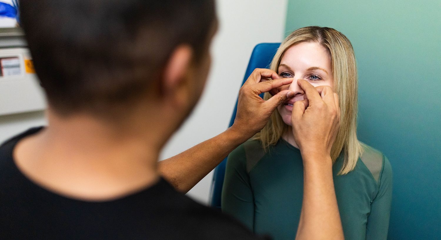 Person receiving cosmetic treatment or consultation.